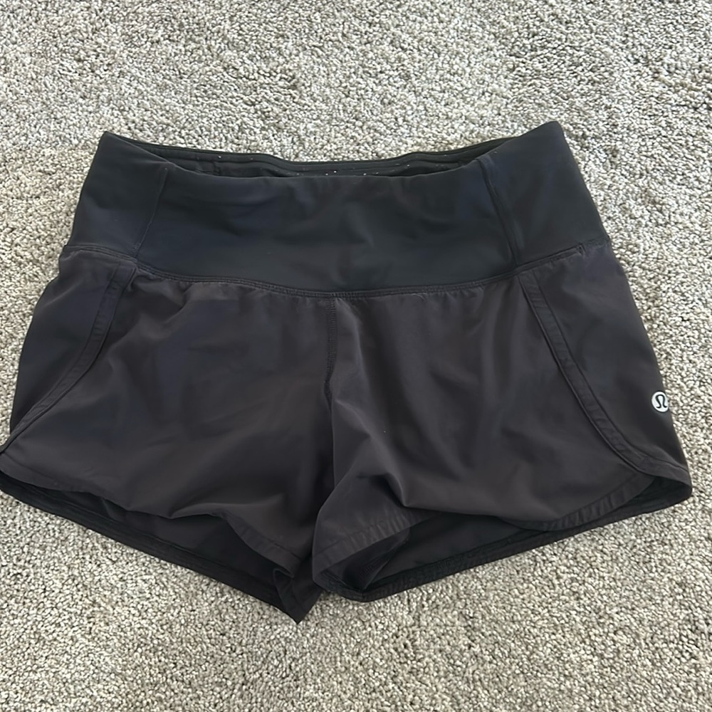 Lululemon mid rise black 4 inch shorts… size 2